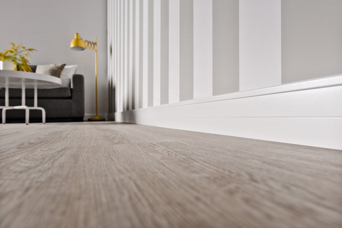 A lifestyle image of the Vox Estilo skirting board E701 in colour white.