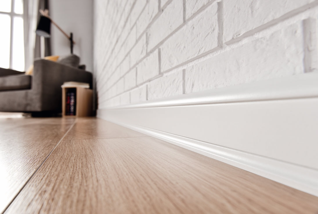 A lifestyle image of the Vox Estilo skirting board E601 in colour white.